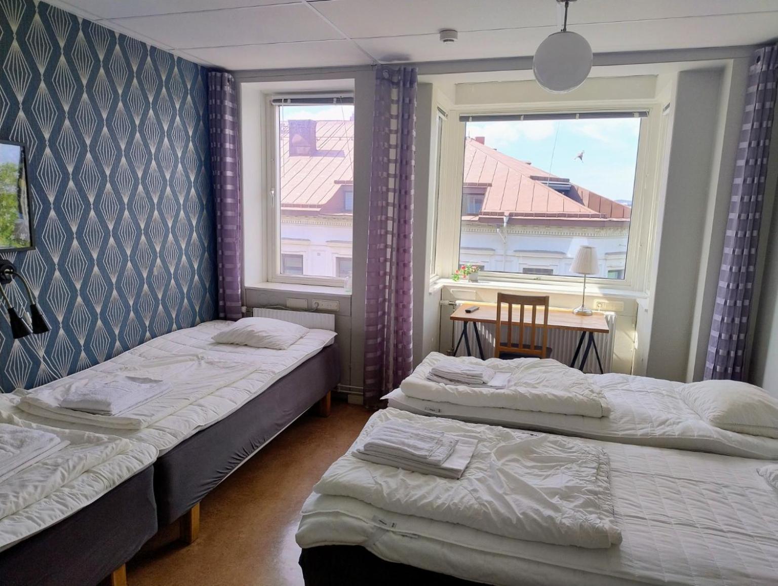 Fyrbäddsrum med delat badrum
